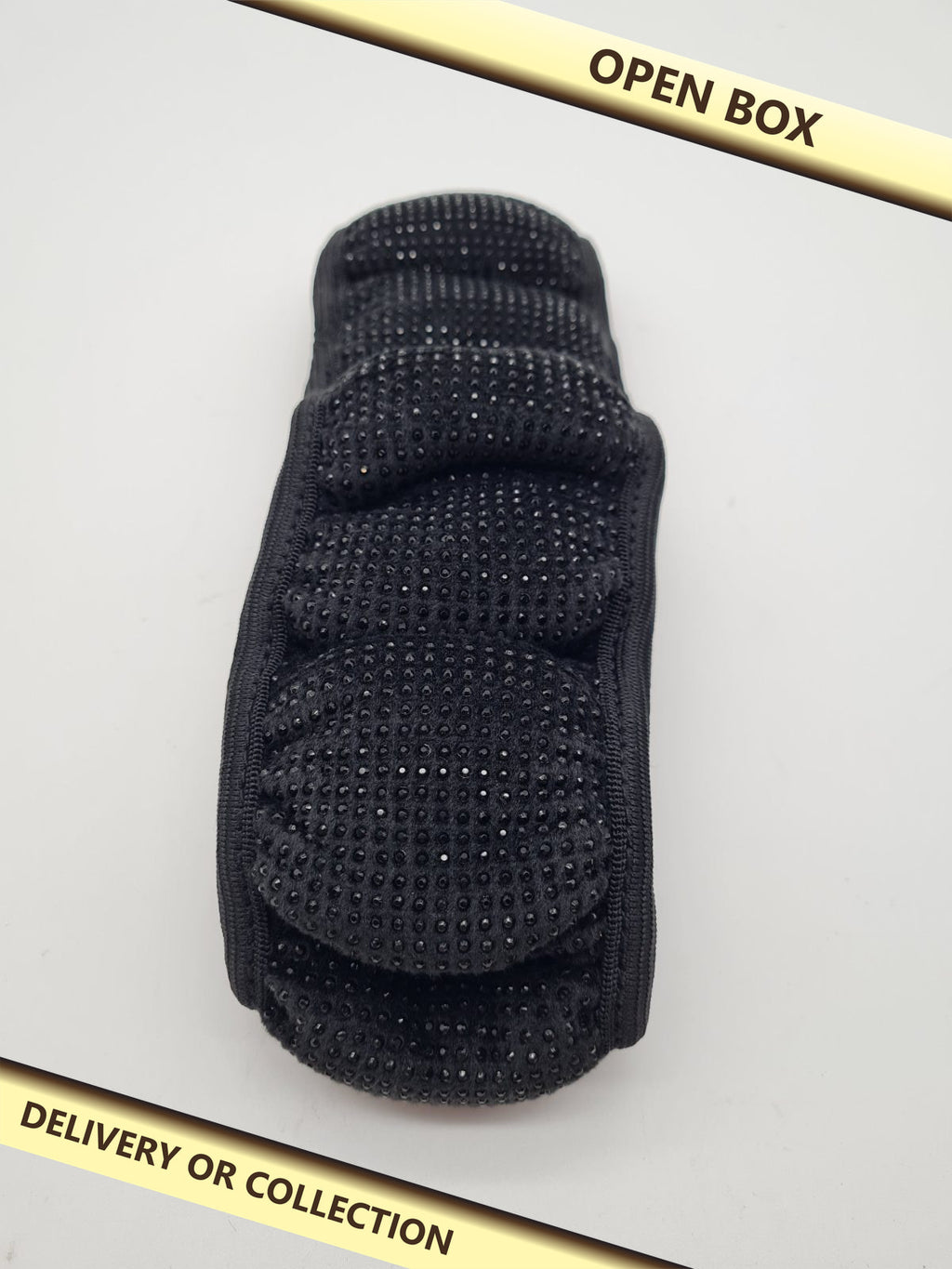 Padded waist support belt — photograph 1 — Open box; auction delivery information shown on image