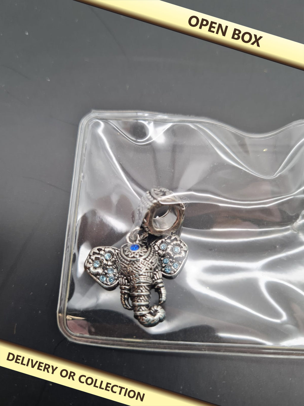 Elephant Dangle Charm — photograph 1 — Open box; auction delivery information shown on image