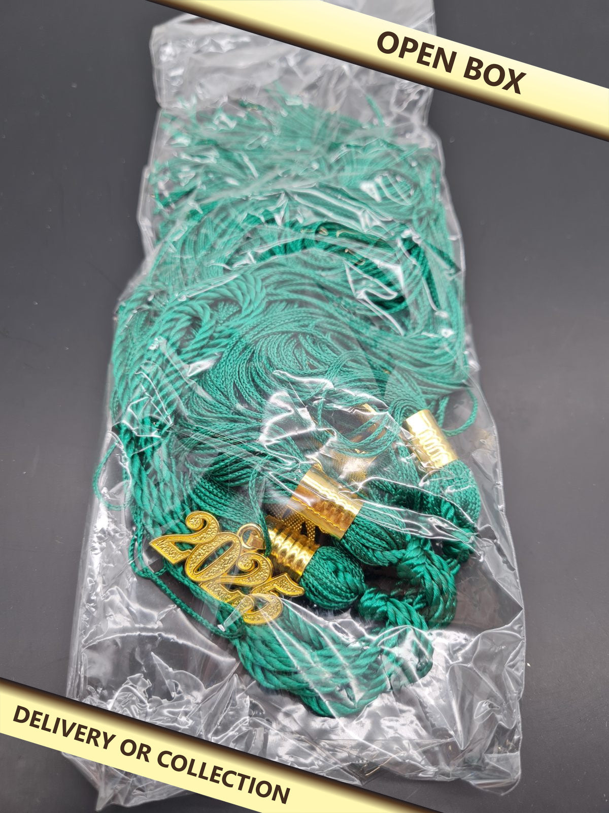 Graduation cap tassel set with 2025 charms — photograph 1 — Open box; auction delivery information shown on image