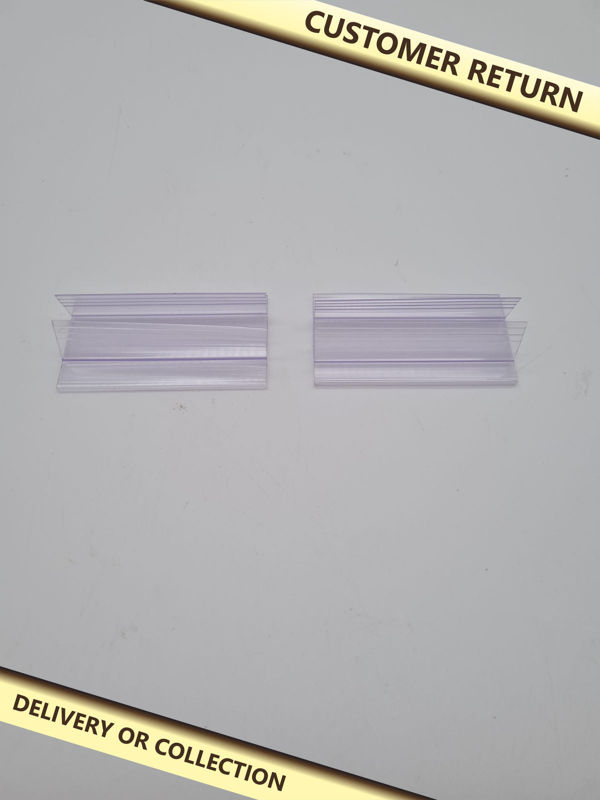 Bundle of plastic channel profiles — photograph 1 — Customer return; auction delivery information shown on image