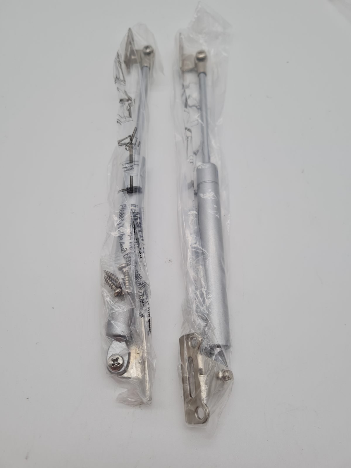 Pair of 120N Cabinet Door Gas Struts — photograph 1