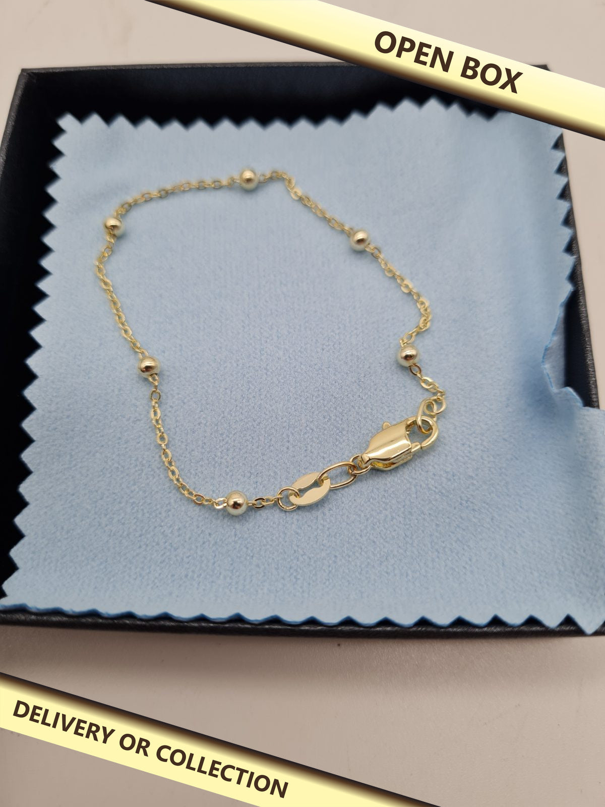 Beaded Chain Bracelet — photograph 1 — Open box; auction delivery information shown on image