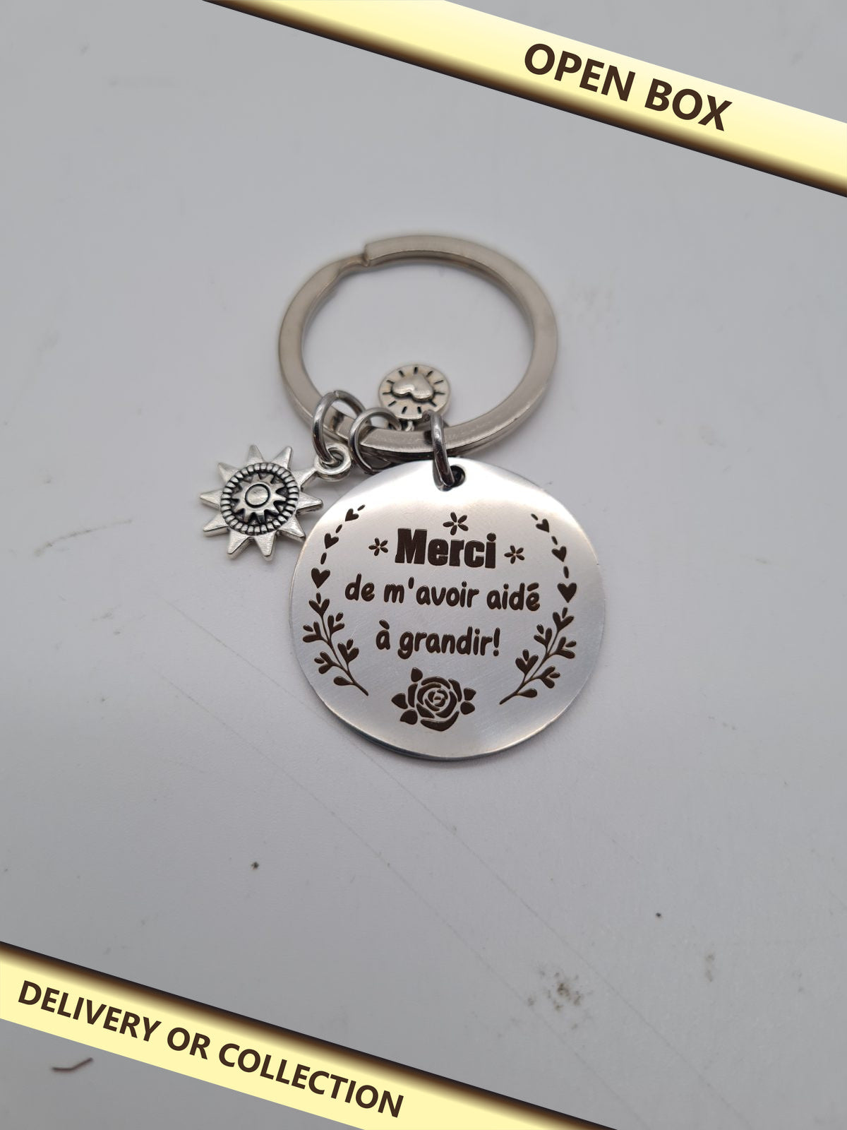 French Thank You Teacher Keyring — photograph 1 — Open box; auction delivery information shown on image