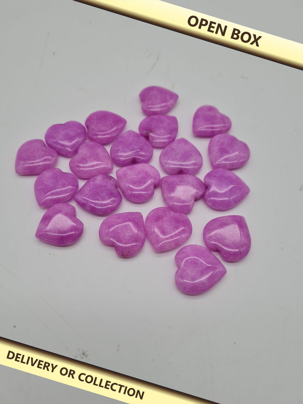 20 Purple Heart-Shaped Decorative Stones — photograph 1 — Open box; auction delivery information shown on image