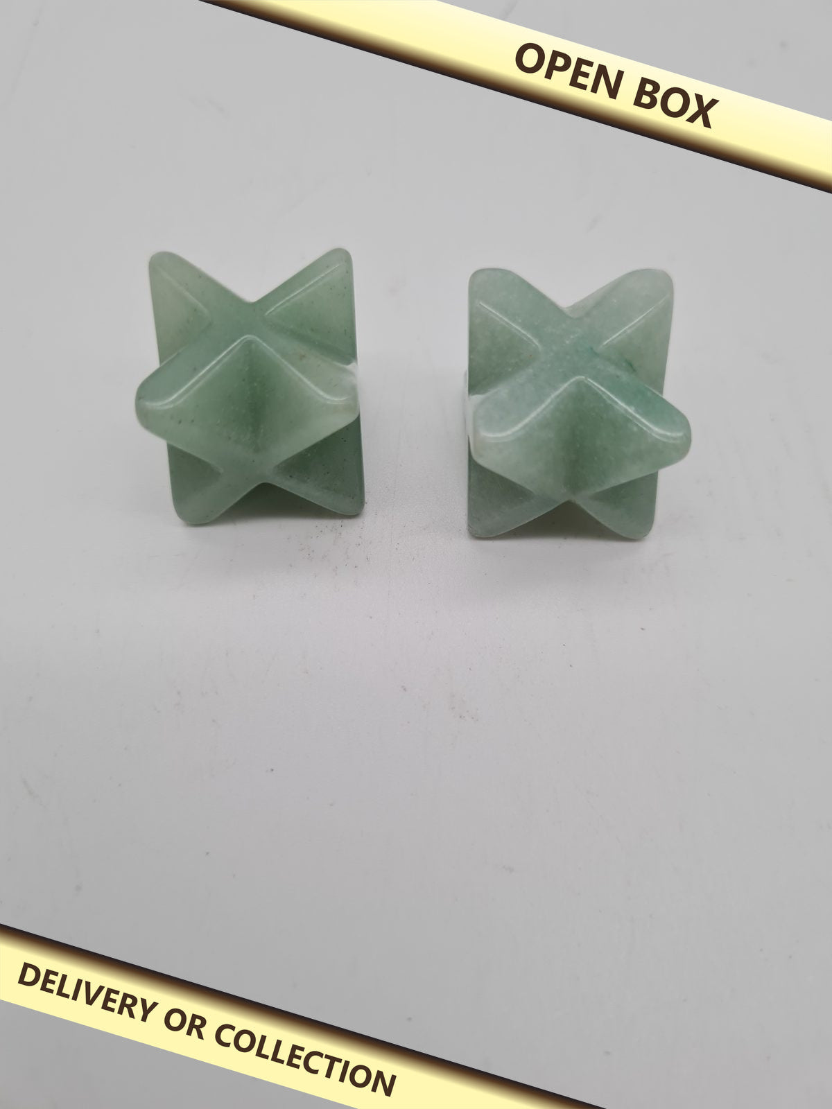 Pair of  green Aventurine Merkaba-Style Star Crystals — photograph 1 — Open box; auction delivery information shown on image