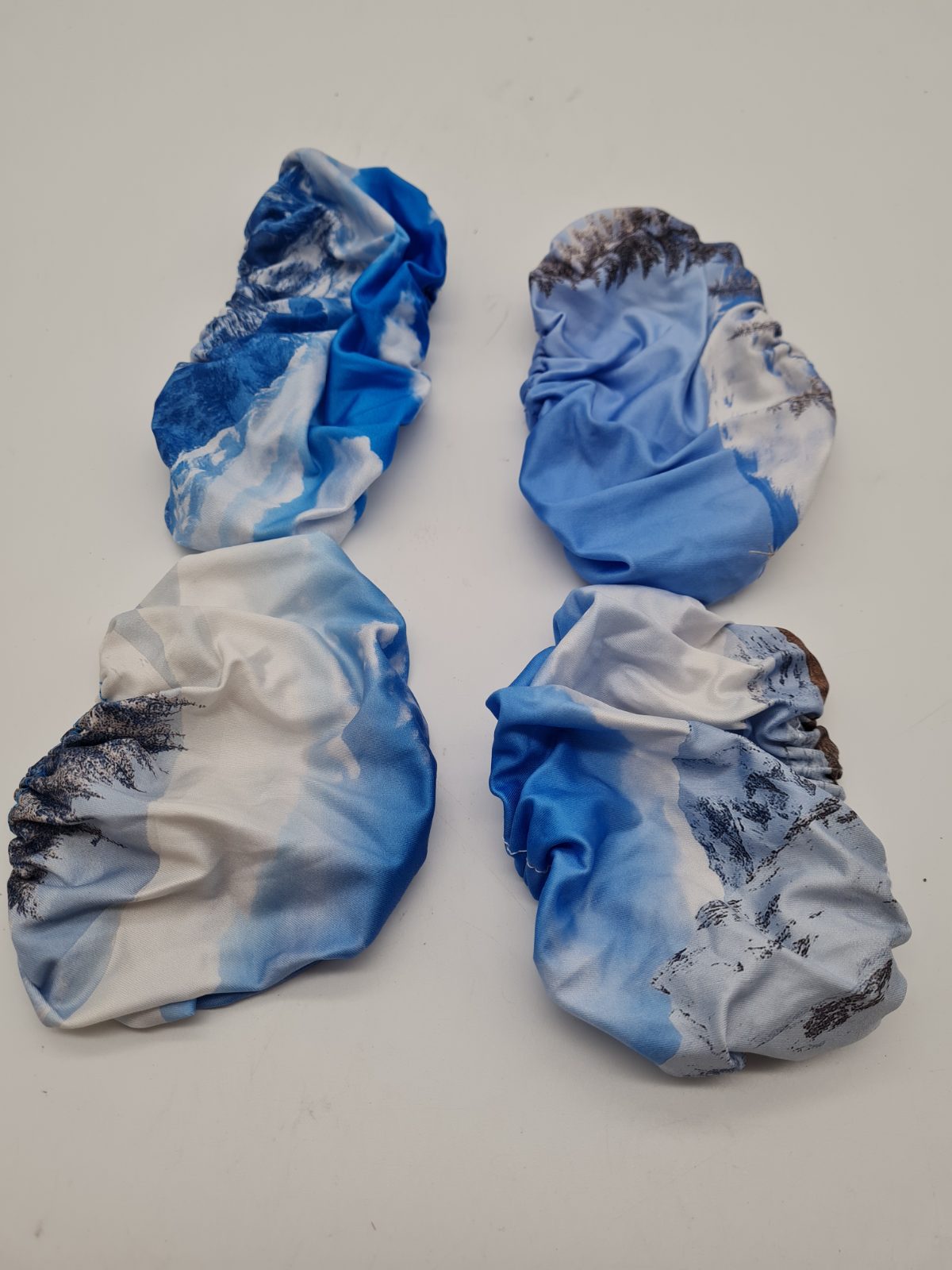 Set of Four Elasticated Fabric Covers — photograph 1