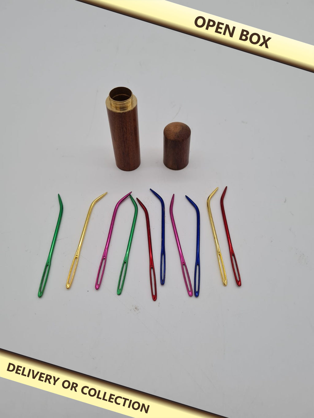 10 Large-Eye Hand Sewing Needles with Wooden Storage Case — photograph 1 — Open box; auction delivery information shown on image