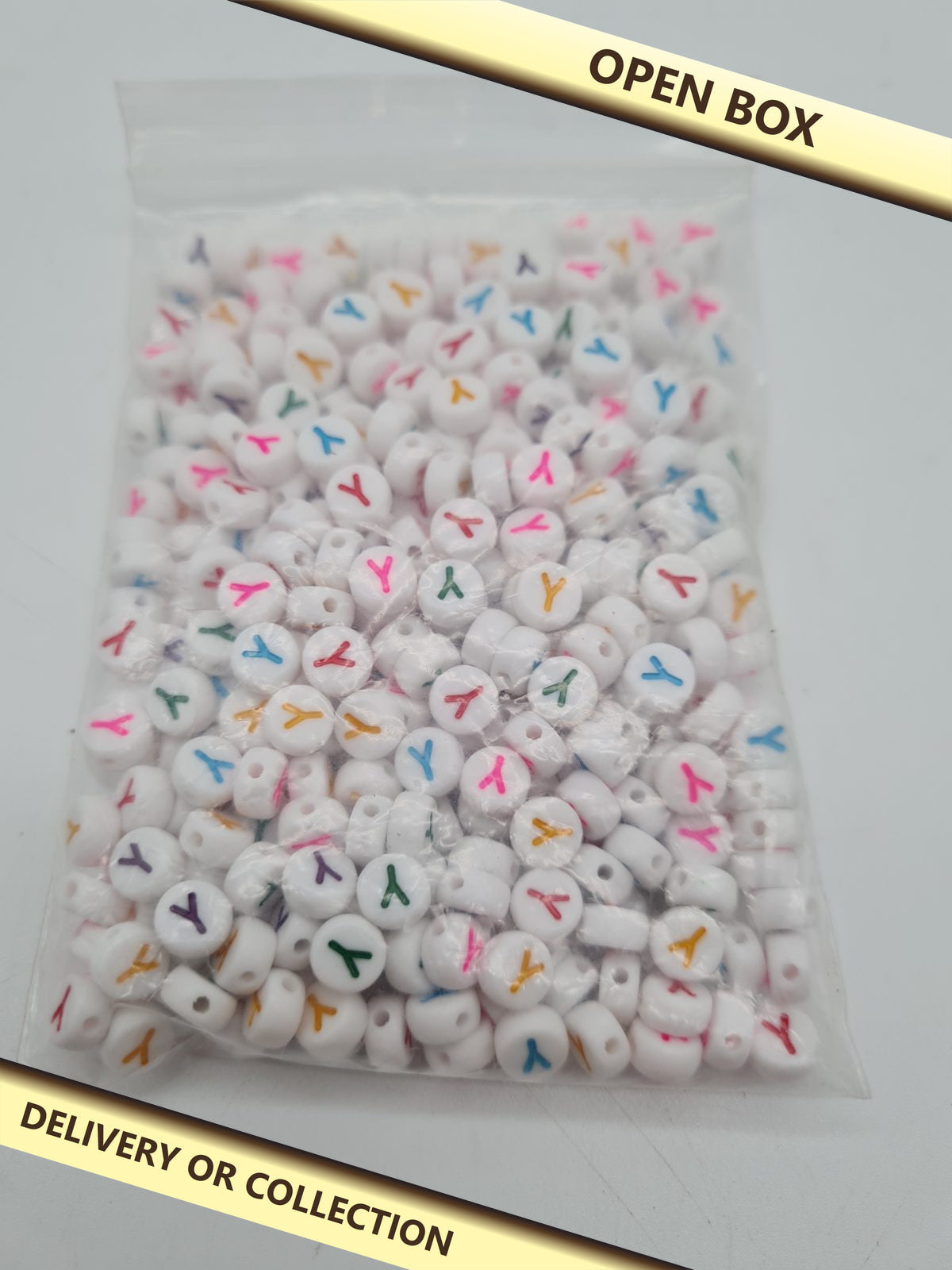 Y Letter Acrylic Craft Beads — photograph 1 — Open box; auction delivery information shown on image