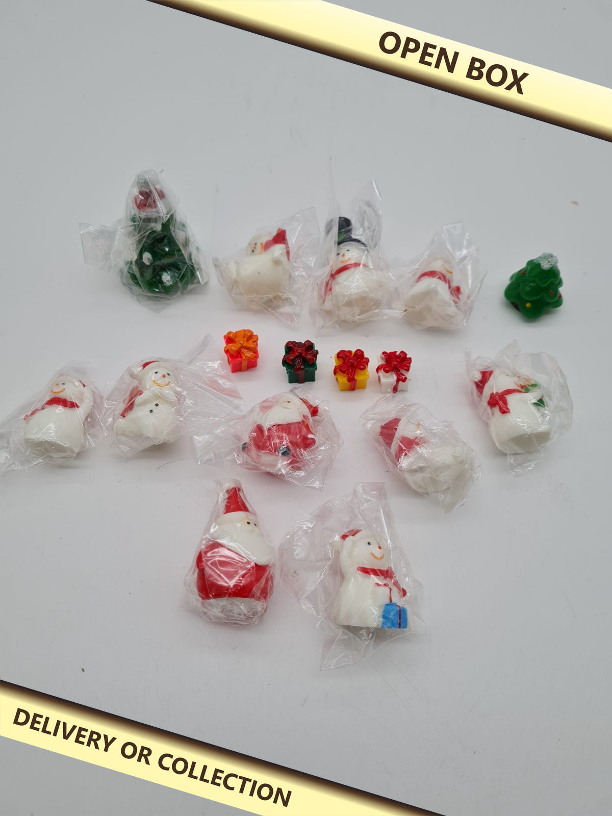 Set of 16 Miniature Christmas Figurine Decorations — photograph 1 — Open box; auction delivery information shown on image