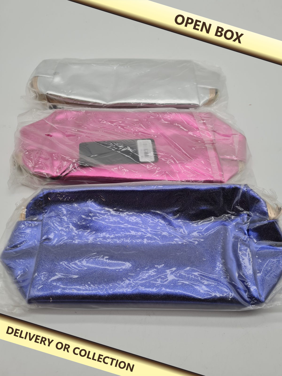 3 pack of metallic-effect makeup bags — photograph 1 — Open box; auction delivery information shown on image