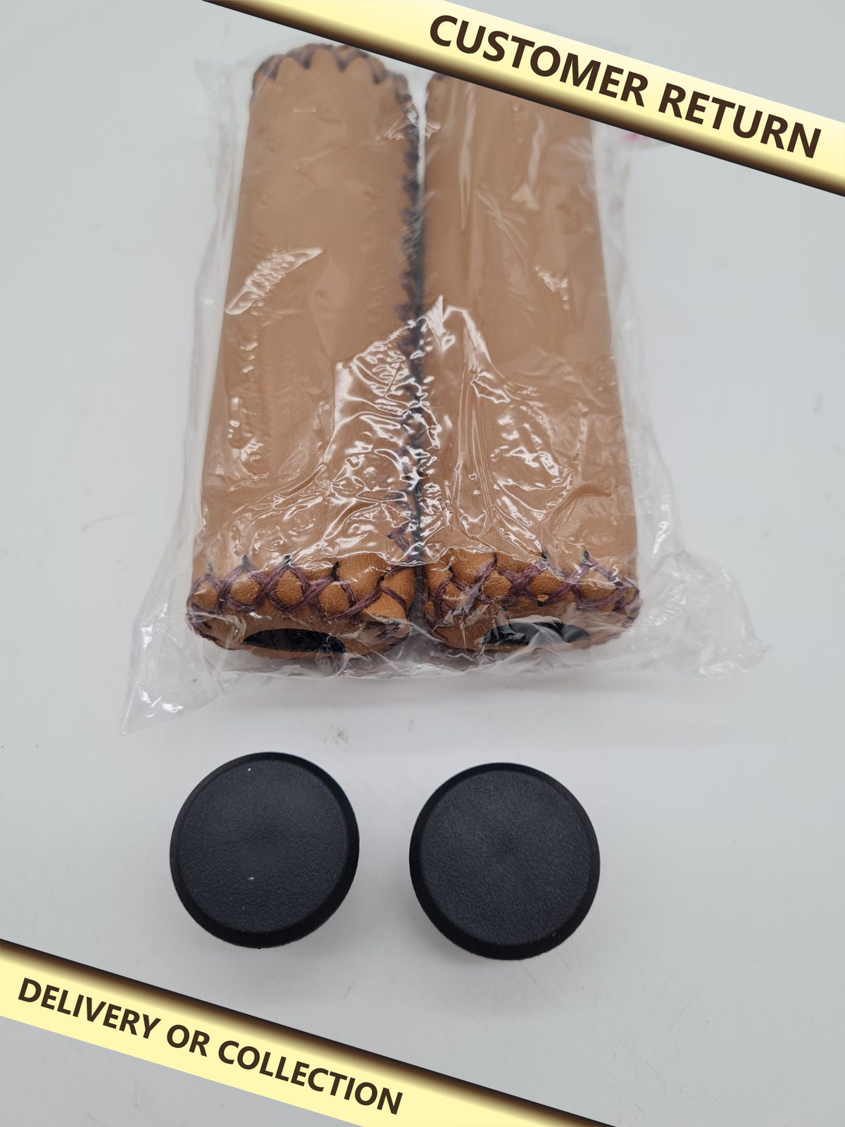 Pair of Motorcycle Handlebar Grips — photograph 1 — Customer return; auction delivery information shown on image