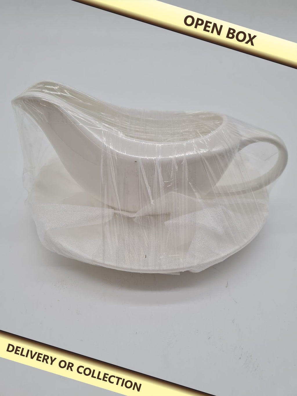 Ceramic Gravy Boat and Saucer Set — photograph 1 — Open box; auction delivery information shown on image