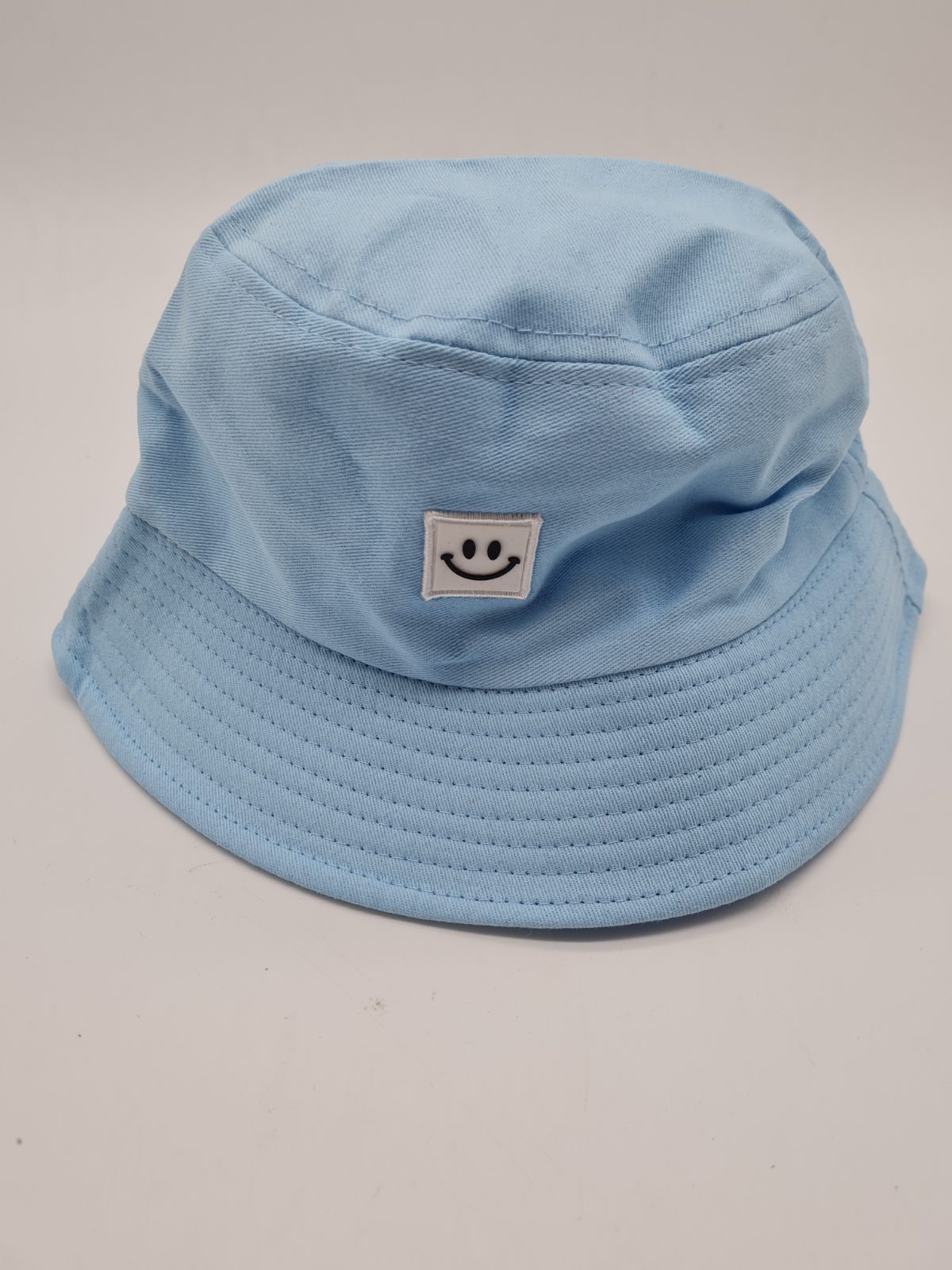 Blue Bucket Hat with Smiley Face Patch — photograph 1