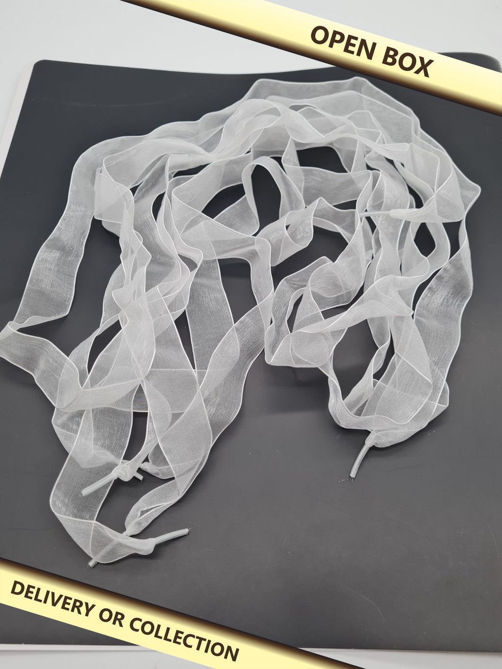 Two Pairs of Sheer Ribbon Shoelaces — photograph 1 — Open box; auction delivery information shown on image