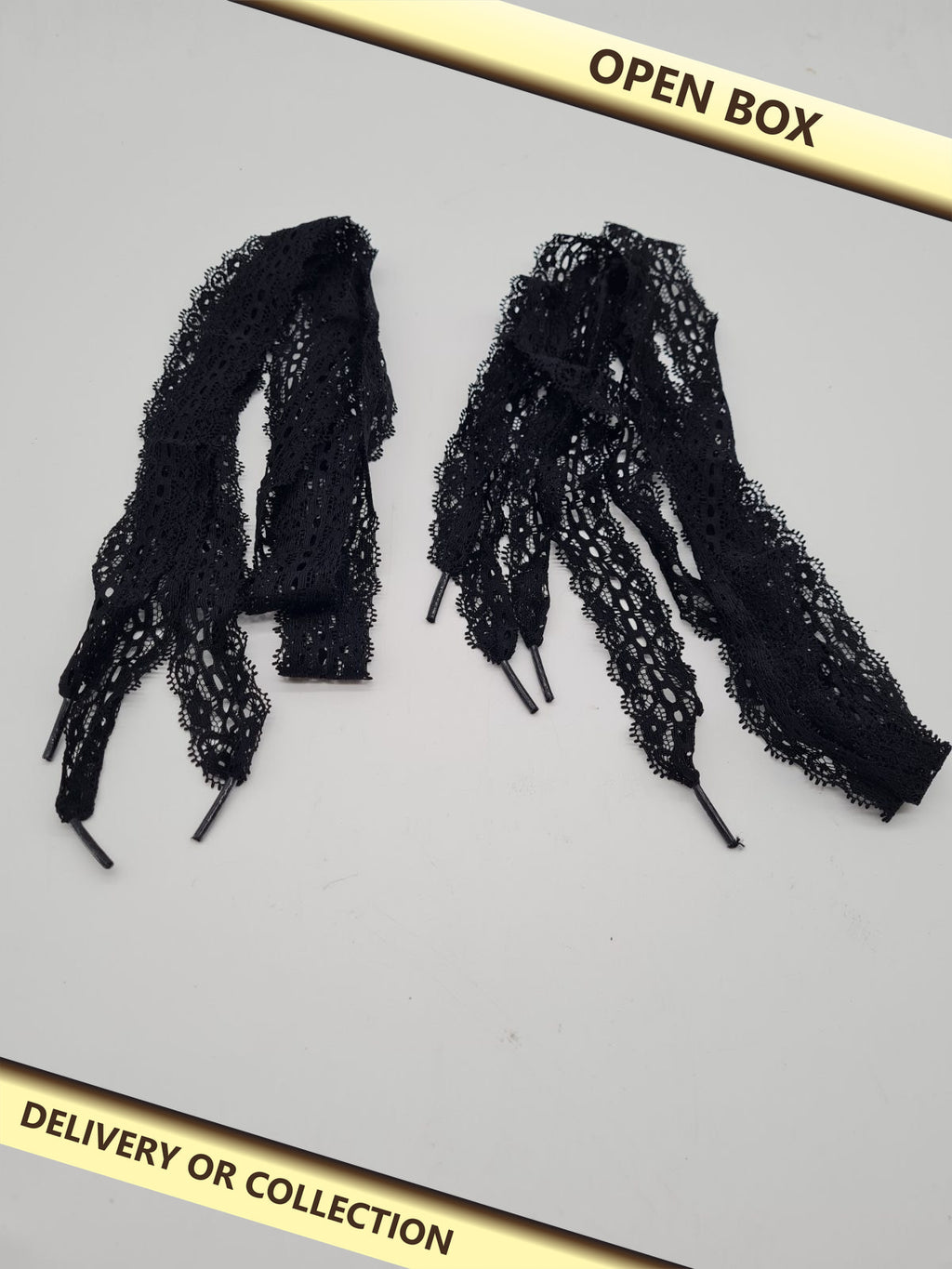 Decorative floral lace shoelaces — photograph 1 — Open box; auction delivery information shown on image