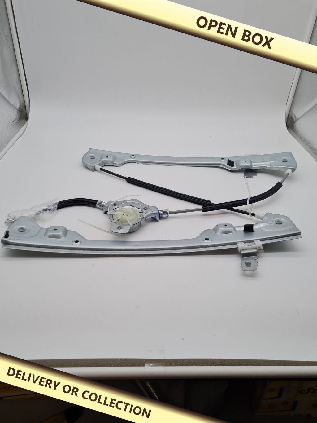 Car Window Regulator Mechanism — photograph 1 — Open box; auction delivery information shown on image