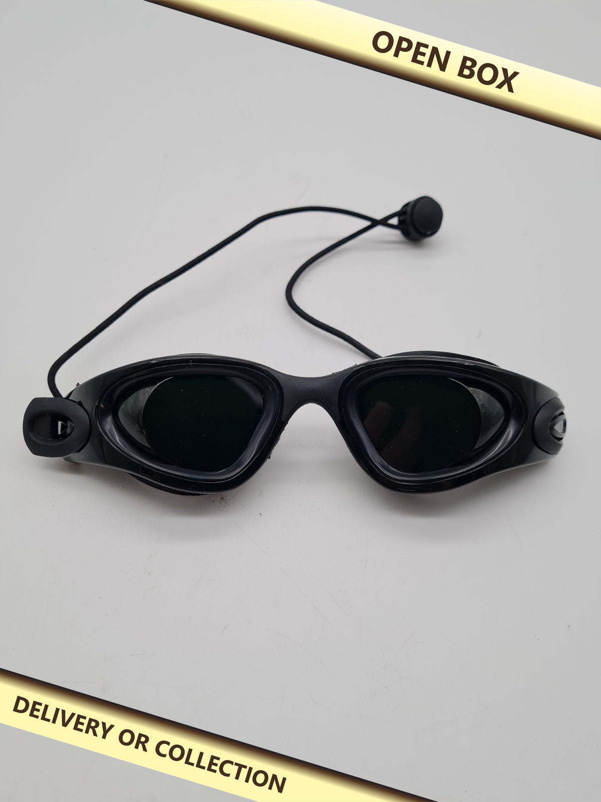 Tanning Goggles — photograph 1 — Open box; auction delivery information shown on image