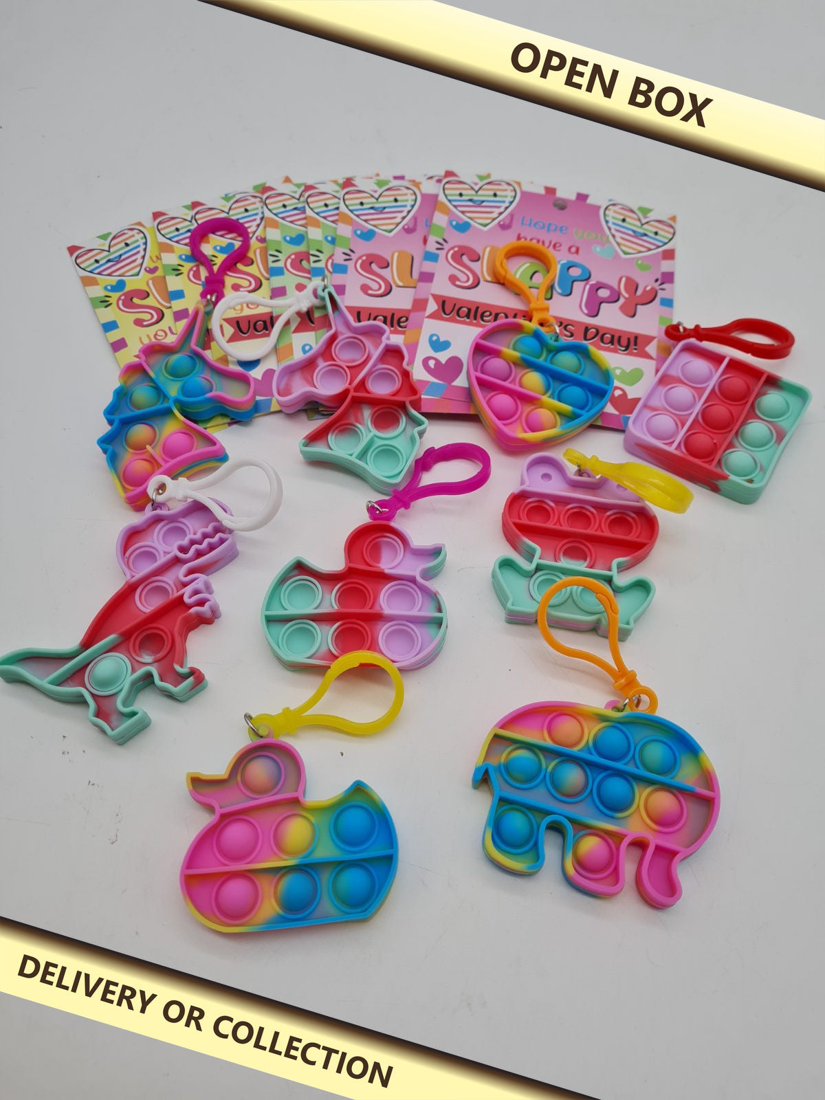 Assorted Mini Bubble Pop Fidget Keyring Set — photograph 1 — Open box; auction delivery information shown on image