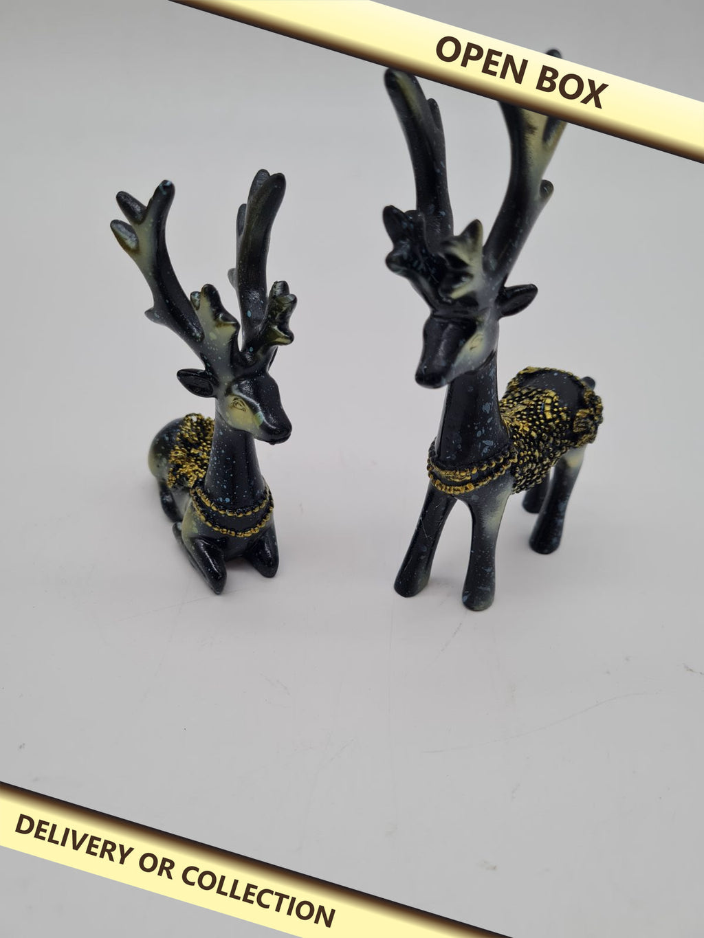 Pair of Decorative Deer Figurines — photograph 1 — Open box; auction delivery information shown on image