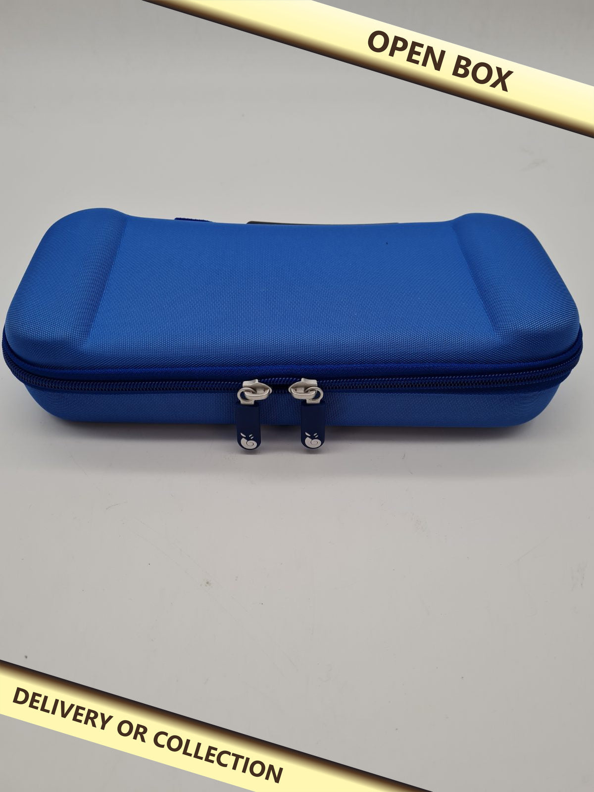 Blue Hard travel case for Nintendo Switch 2 controller — photograph 1 — Open box; auction delivery information shown on image