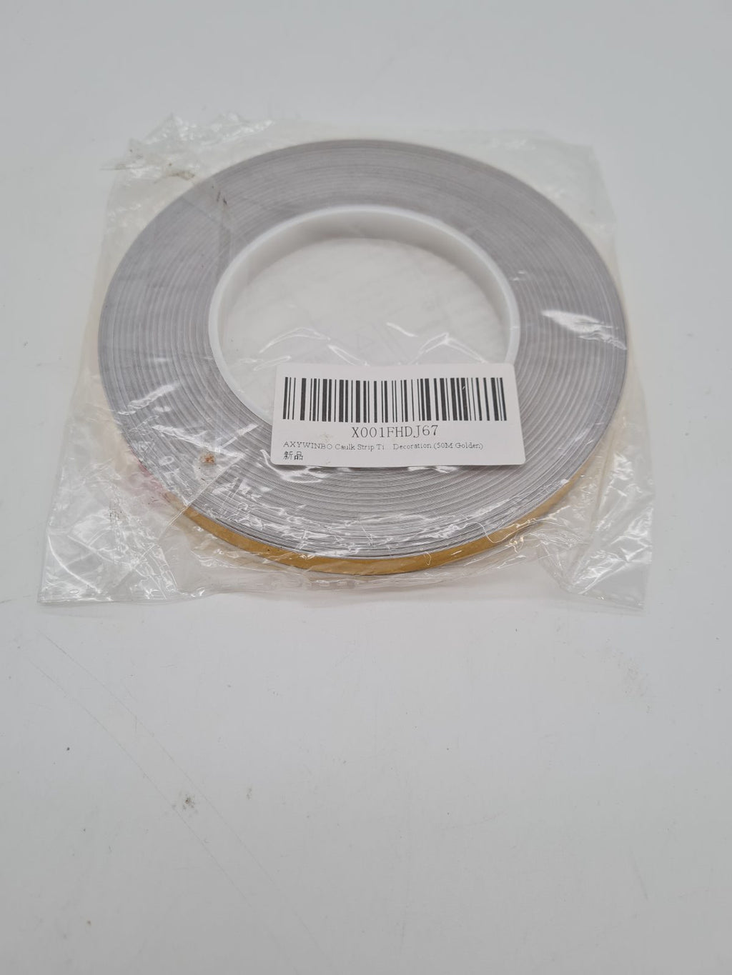 Decorative gold Caulk Strip Tape Roll — photograph 2