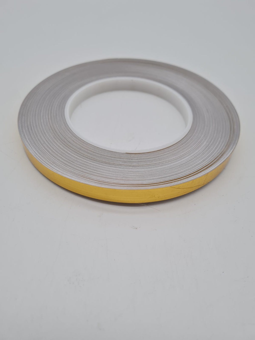 Decorative gold Caulk Strip Tape Roll — photograph 1