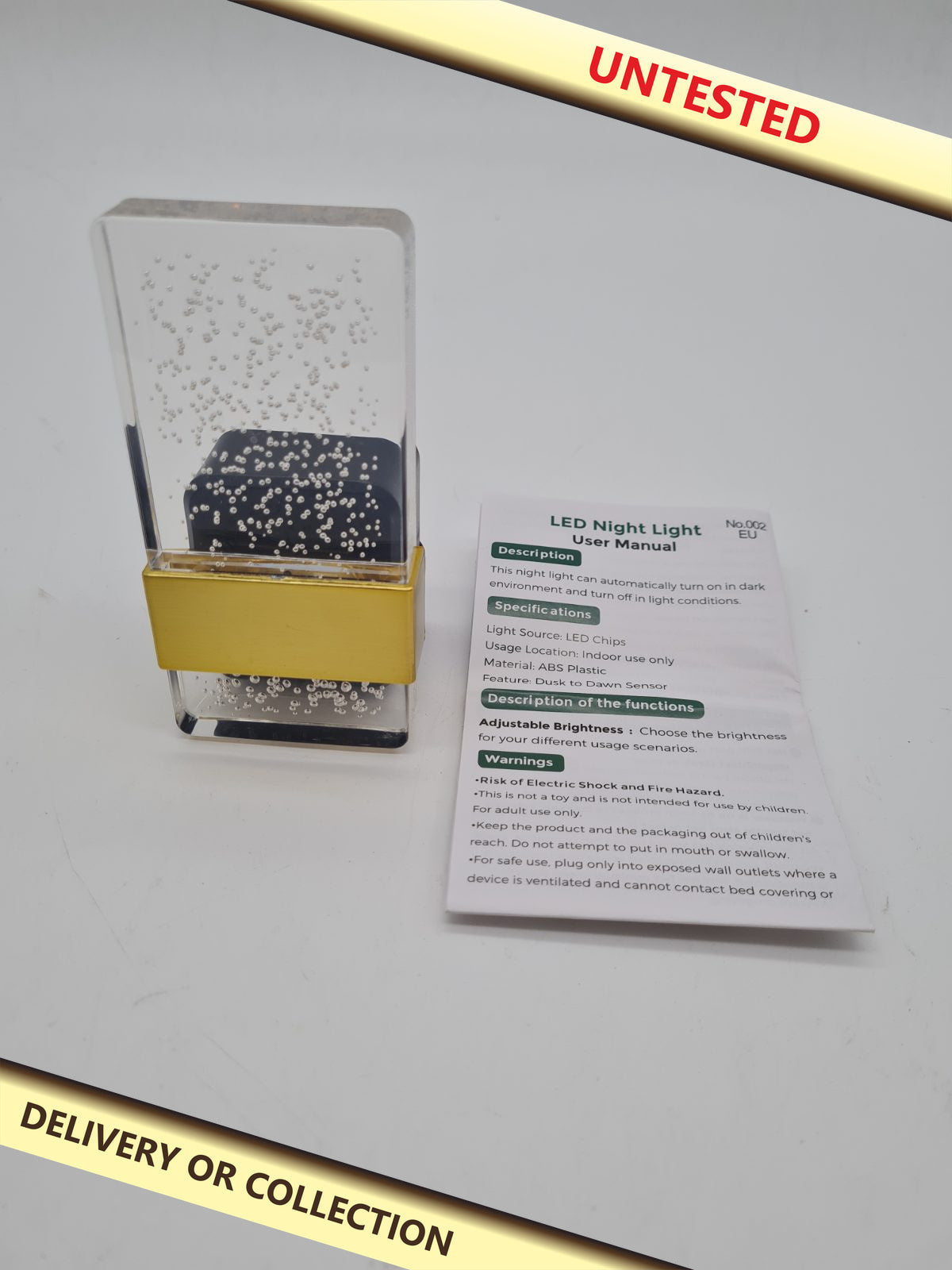 Plug-In LED Night Light — photograph 1 — Untested; auction delivery information shown on image