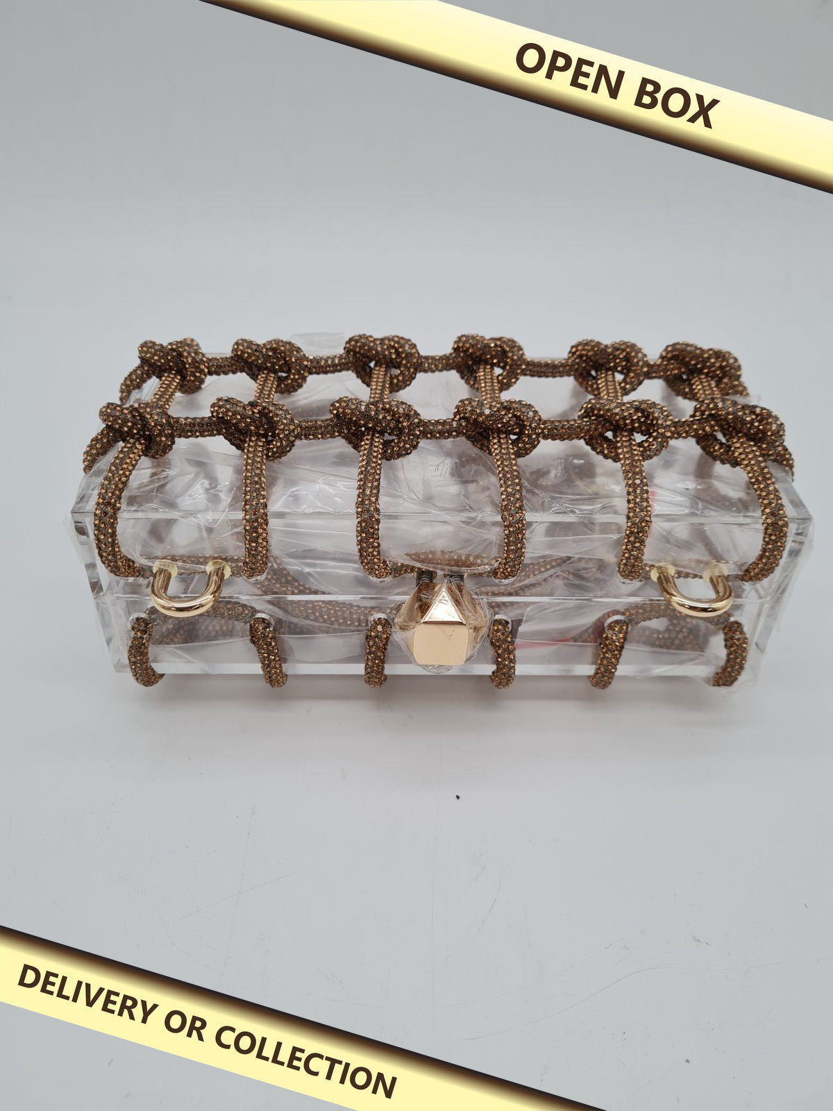 Rhinestone Knot Cage Acrylic Clutch Bag — photograph 1 — Open box; auction delivery information shown on image