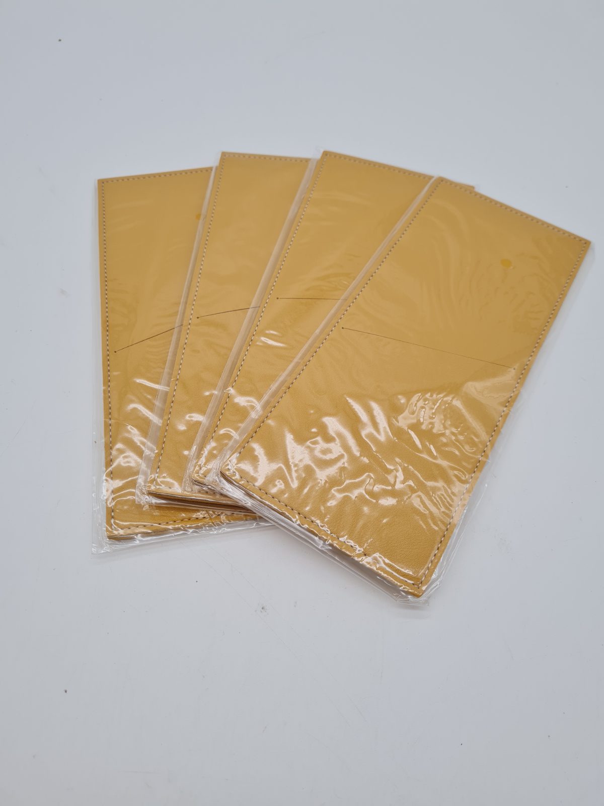 Set of 4 leather yellow Cutlery Sleeves — photograph 1
