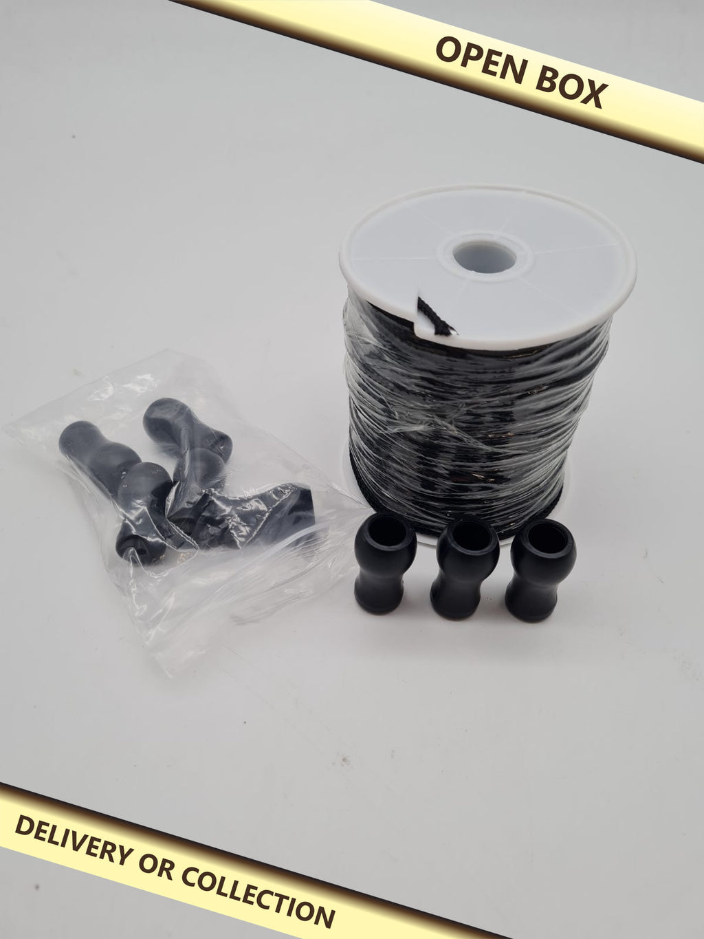 Braided cord and pull handle set — photograph 1 — Open box; auction delivery information shown on image