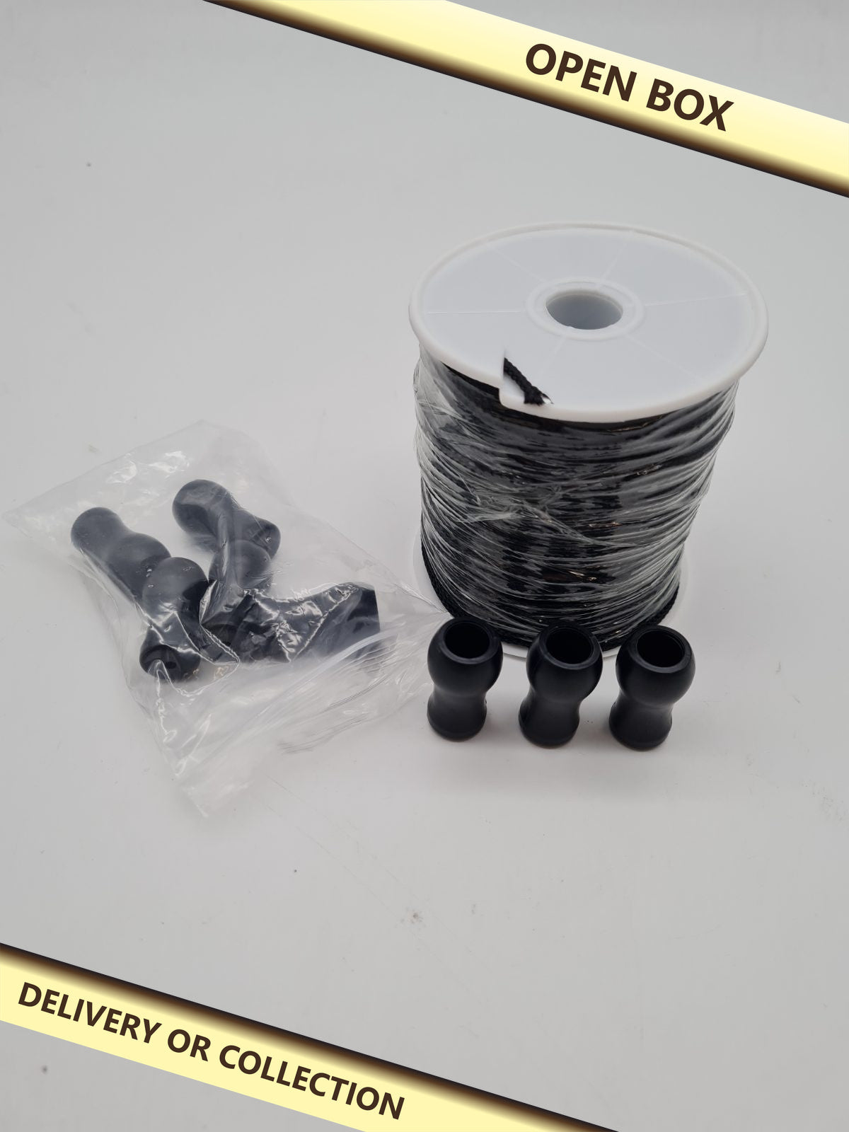Braided cord and pull handle set — photograph 1 — Open box; auction delivery information shown on image