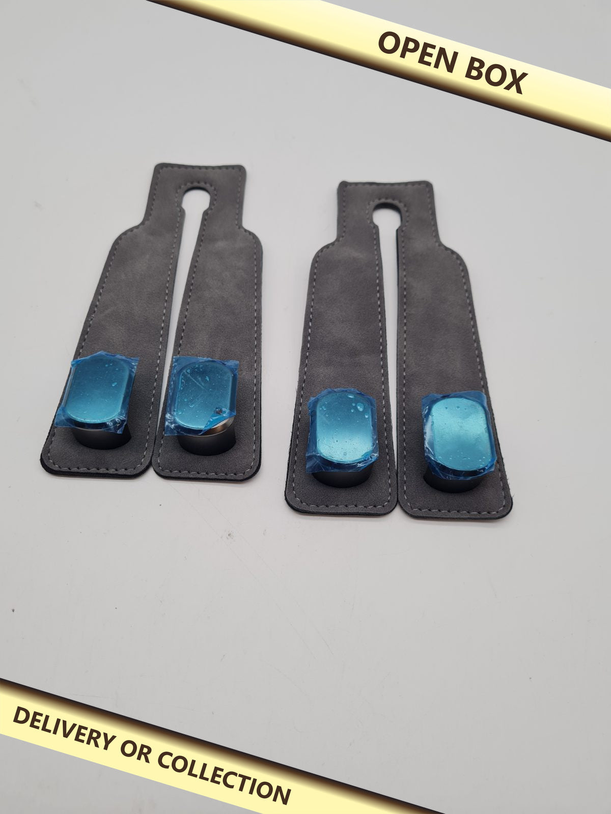 Pair of Magnetic Curtain Tiebacks — photograph 1 — Open box; auction delivery information shown on image