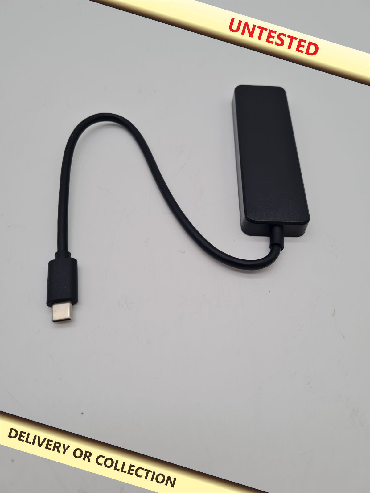 USB-C 3.0 4-Port USB Hub — photograph 1 — Untested; auction delivery information shown on image