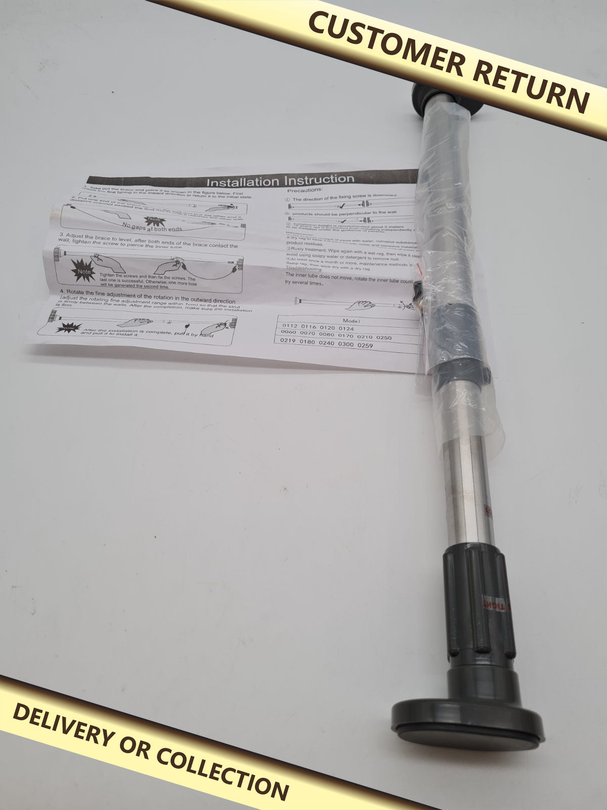 Adjustable Telescopic Tension Rod — photograph 1 — Customer return; auction delivery information shown on image