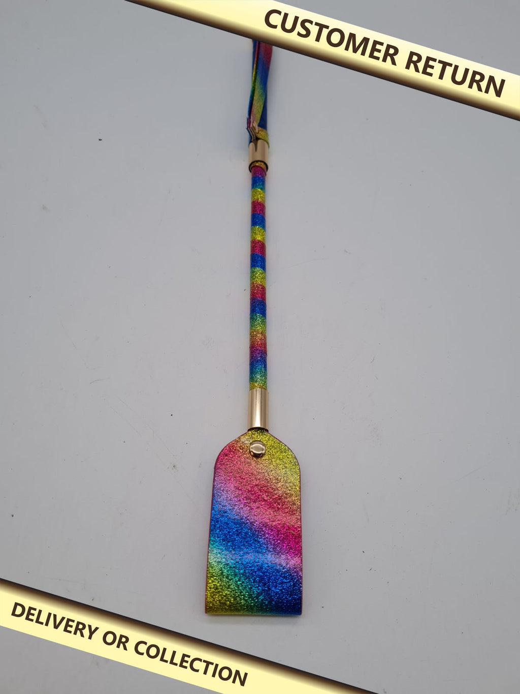 Rainbow Glitter Paddle Riding Crop — photograph 1 — Customer return; auction delivery information shown on image