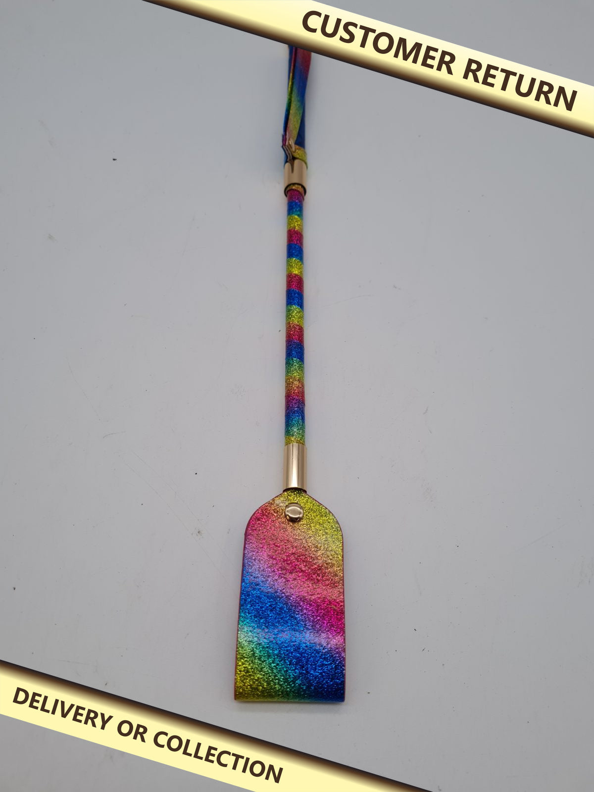 Rainbow Glitter Paddle Riding Crop — photograph 1 — Customer return; auction delivery information shown on image