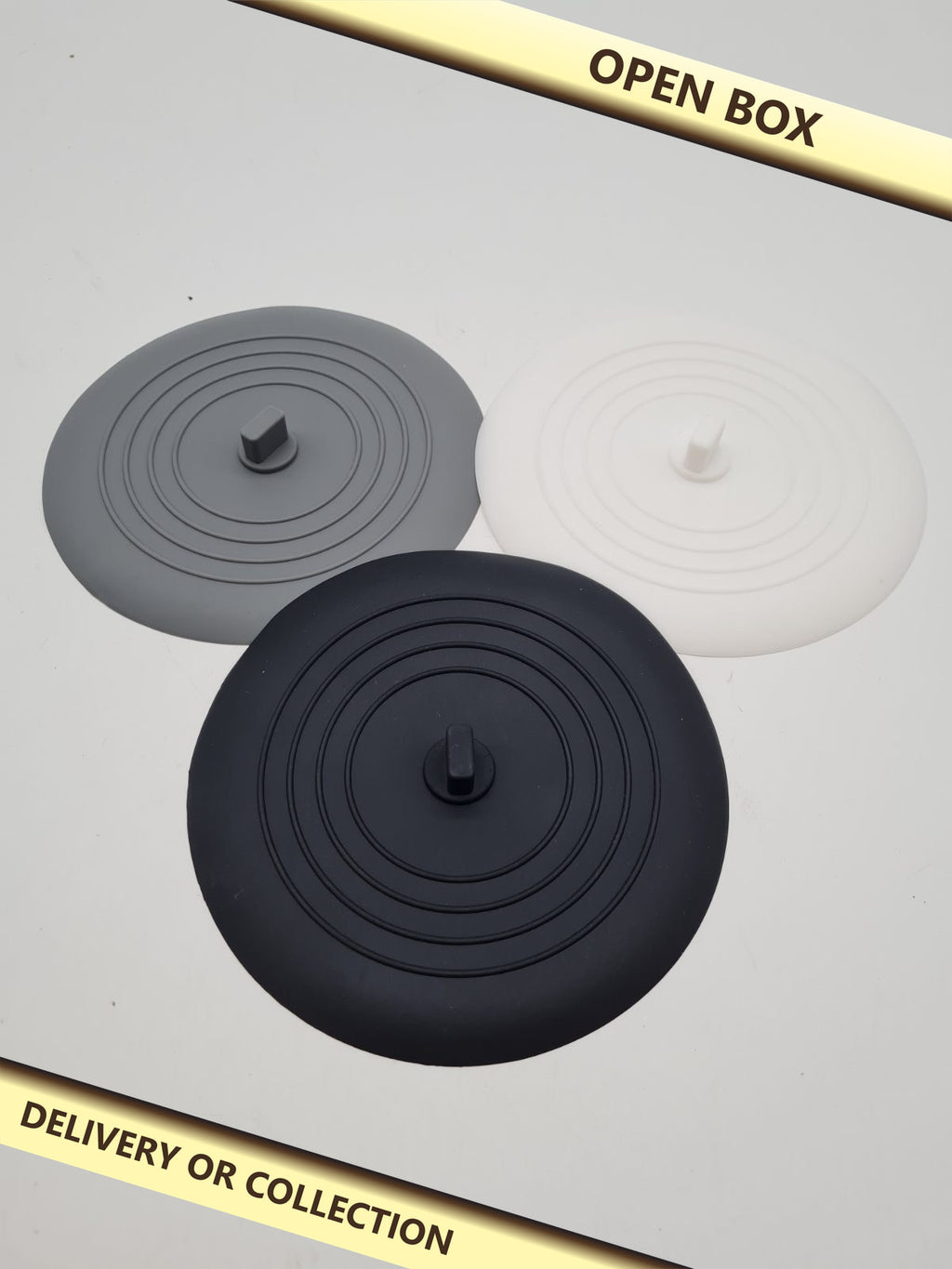 Set of 3 Silicone Drain Plugs — photograph 1 — Open box; auction delivery information shown on image