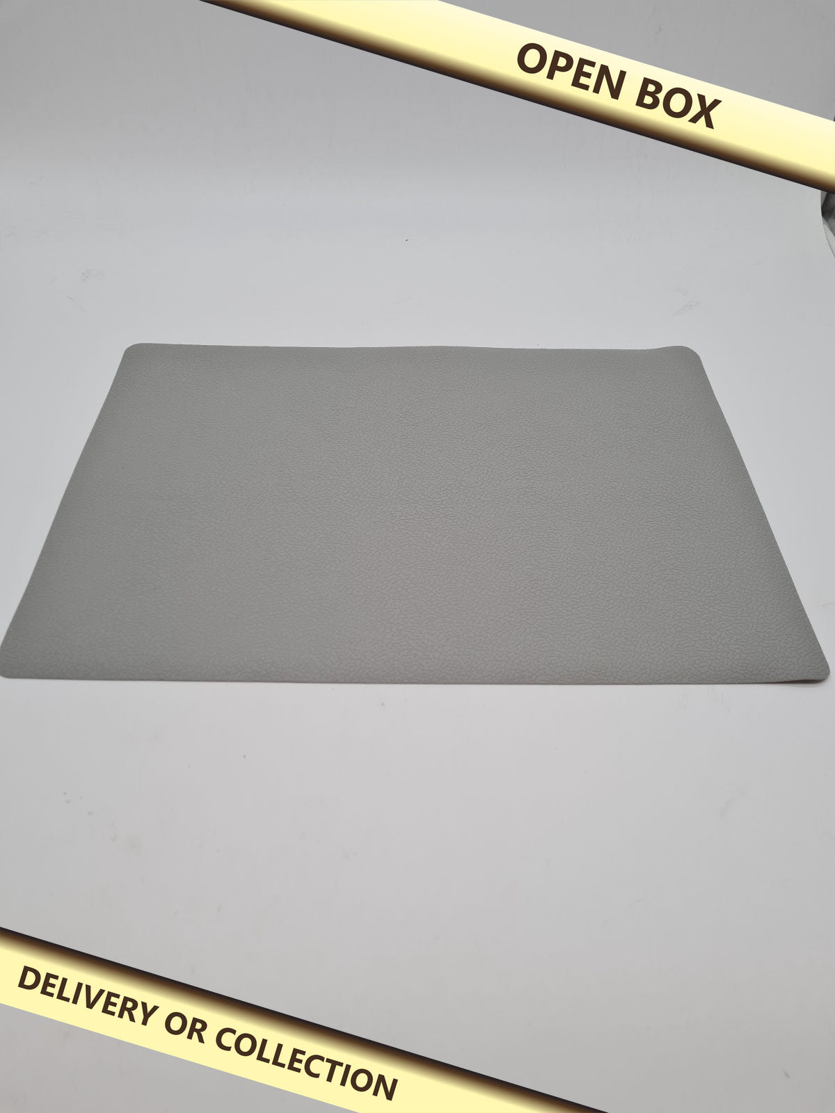 Silicone Placemats – Set of 4 — photograph 1 — Open box; auction delivery information shown on image