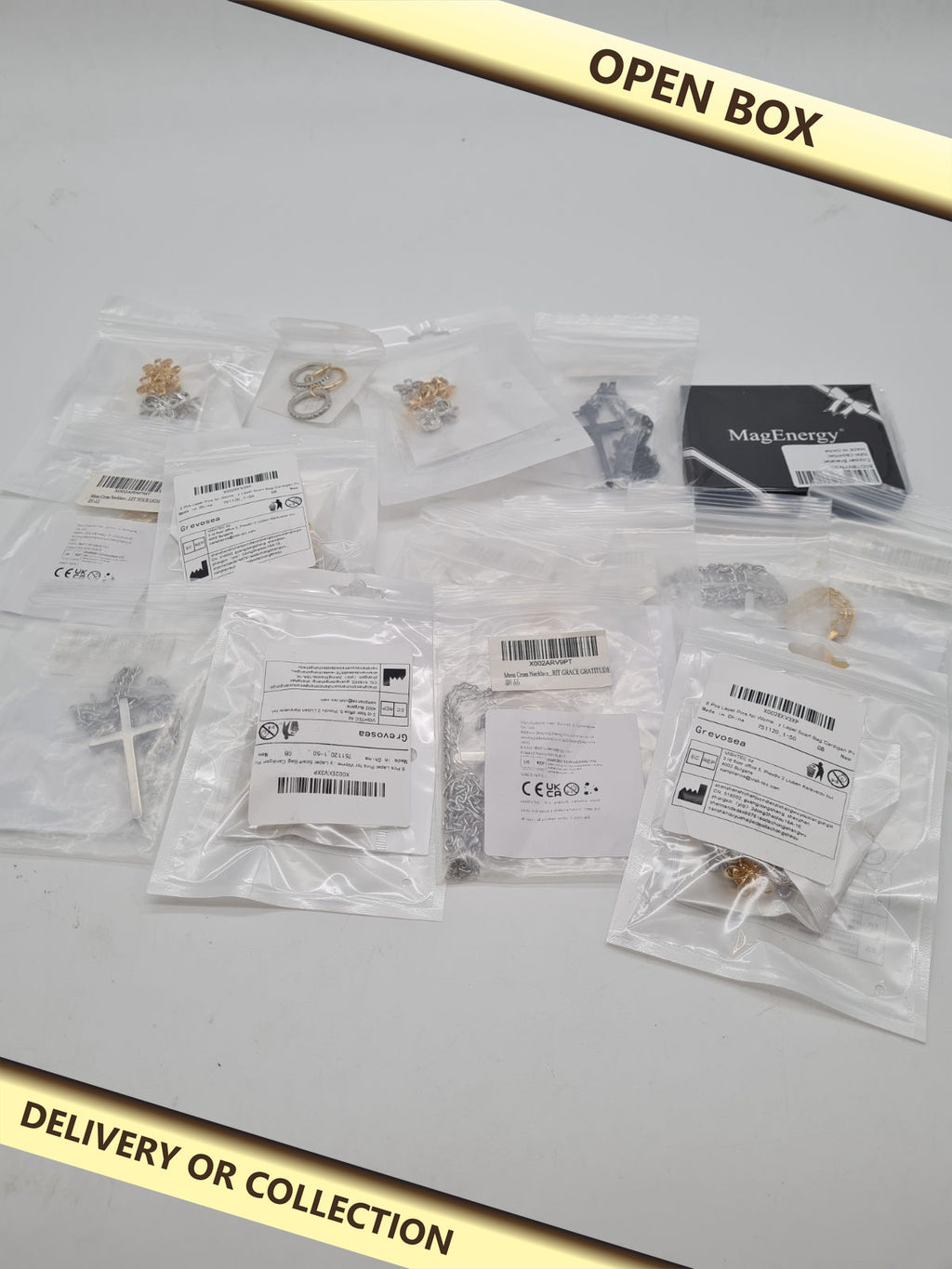 Mixed jewellery bundle — photograph 1 — Open box; auction delivery information shown on image