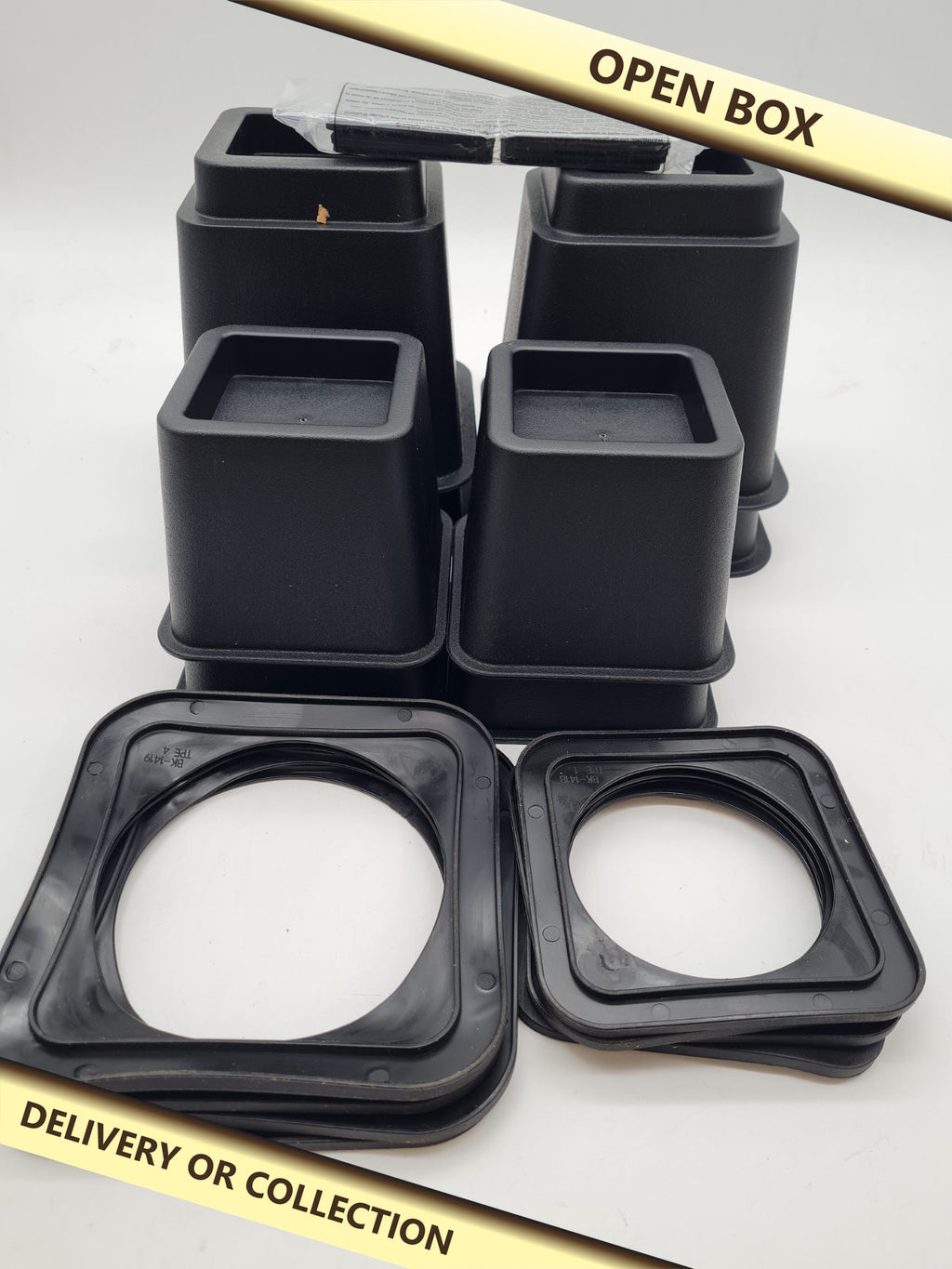 Adjustable Furniture Risers Set of 8 — photograph 1 — Open box; auction delivery information shown on image