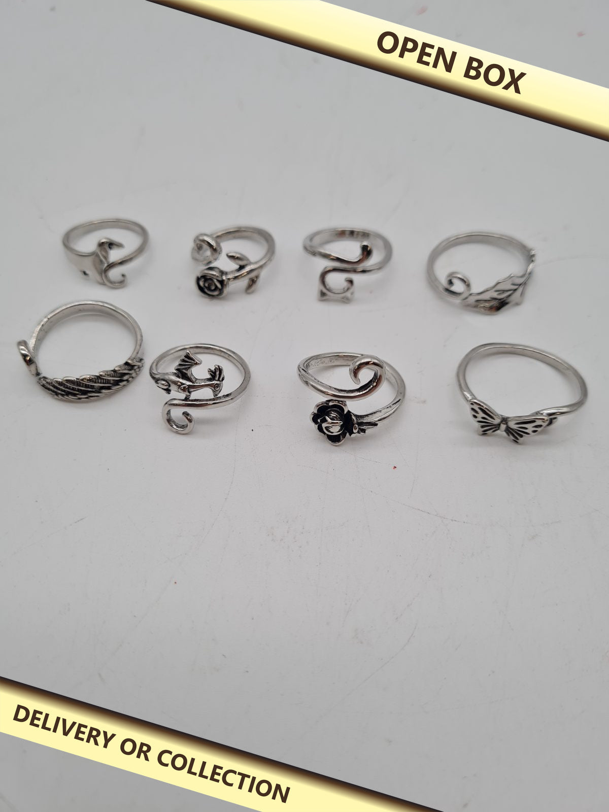 5 packs of 8-Piece Adjustable Crochet Tension Ring Set — photograph 1 — Open box; auction delivery information shown on image