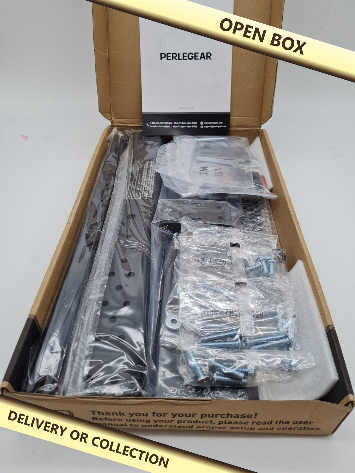Tabletop TV Stand PGTVS33 — photograph 1 — Open box; auction delivery information shown on image