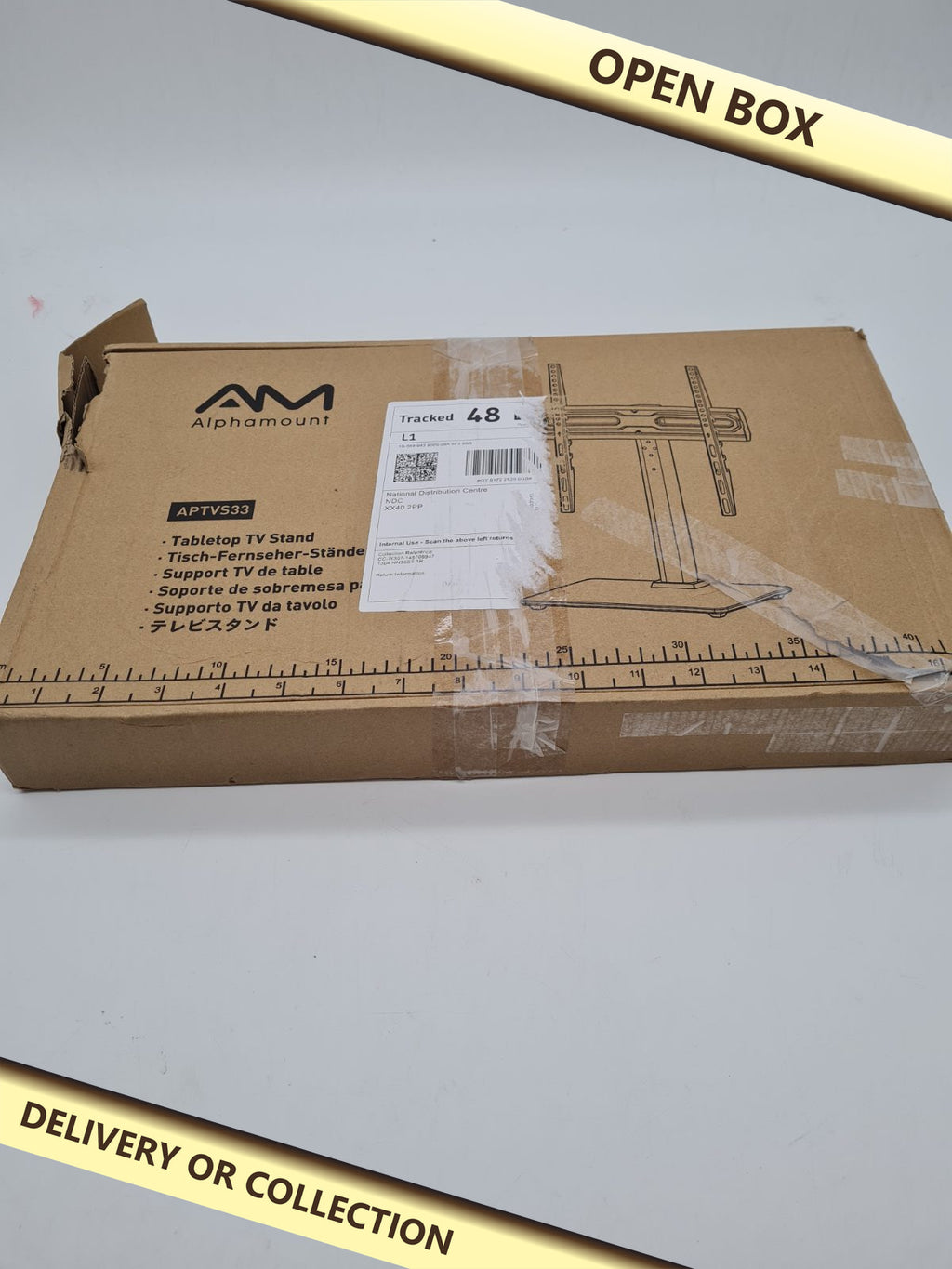 Tabletop TV Stand APTVS33 — photograph 1 — Open box; auction delivery information shown on image