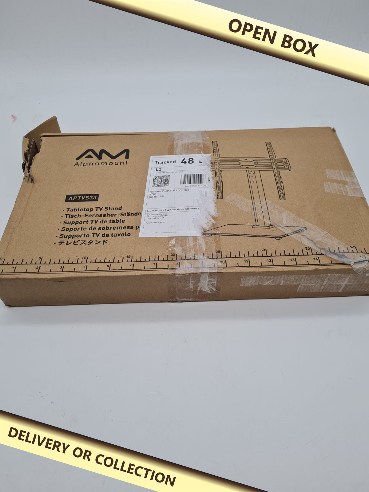 Tabletop TV Stand APTVS33 — photograph 1 — Open box; auction delivery information shown on image