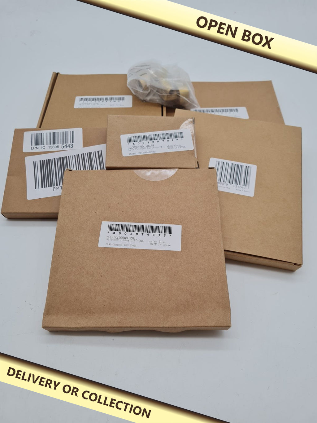 Mixed variety bundle — photograph 1 — Open box; auction delivery information shown on image