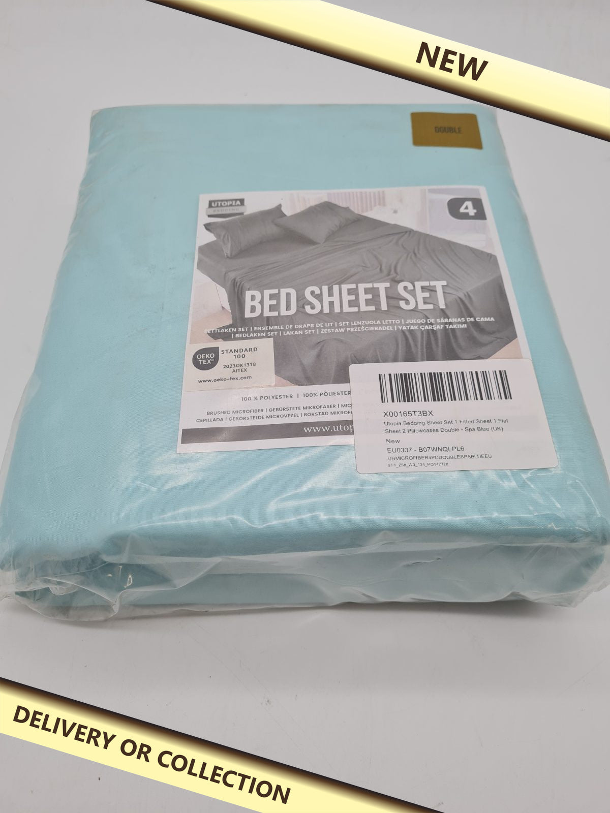Double 4-Piece Bed Sheet Set in blue — photograph 1 — New; auction delivery information shown on image