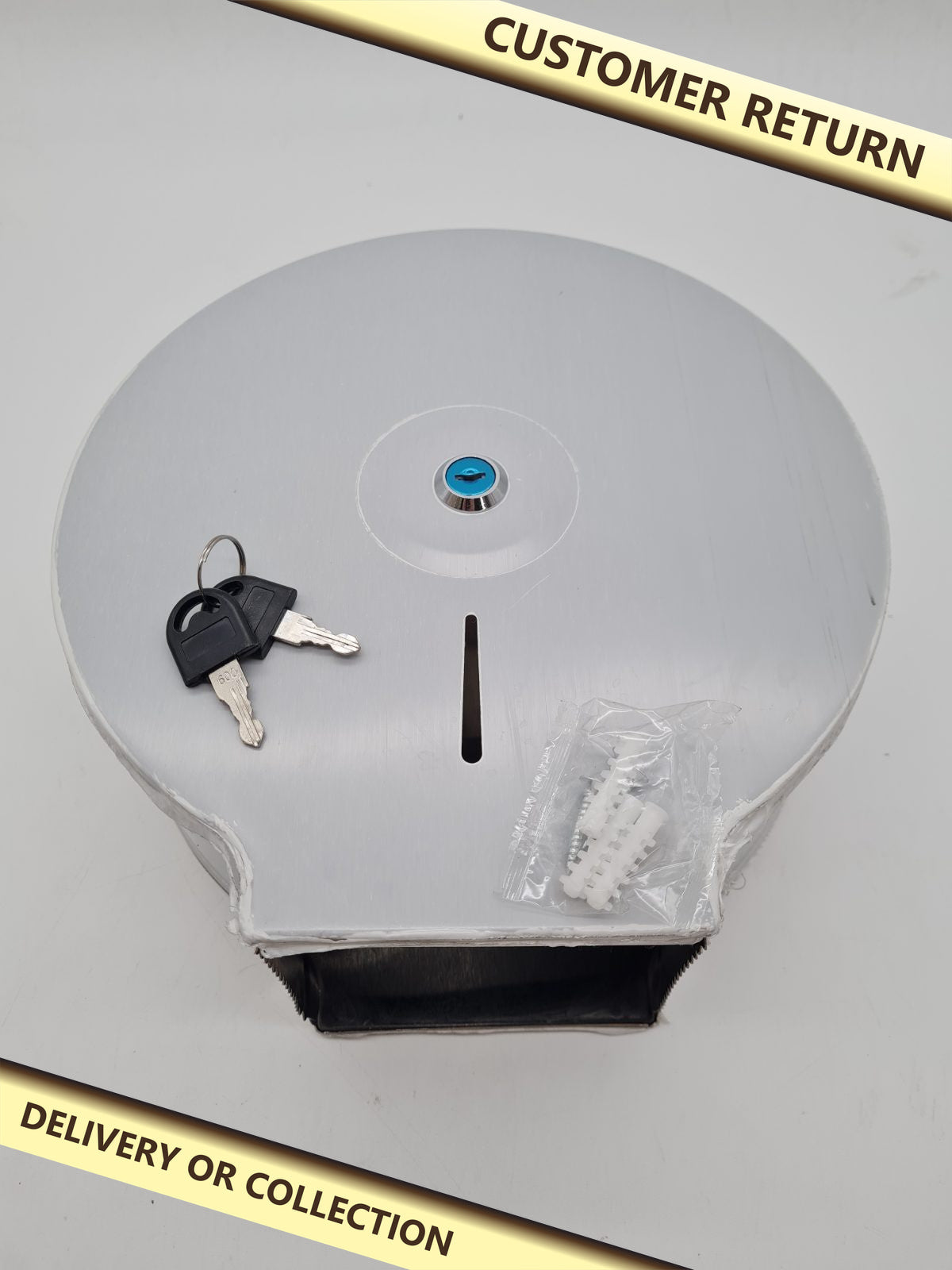 Lockable Jumbo Toilet Roll Dispenser — photograph 1 — Customer return; auction delivery information shown on image