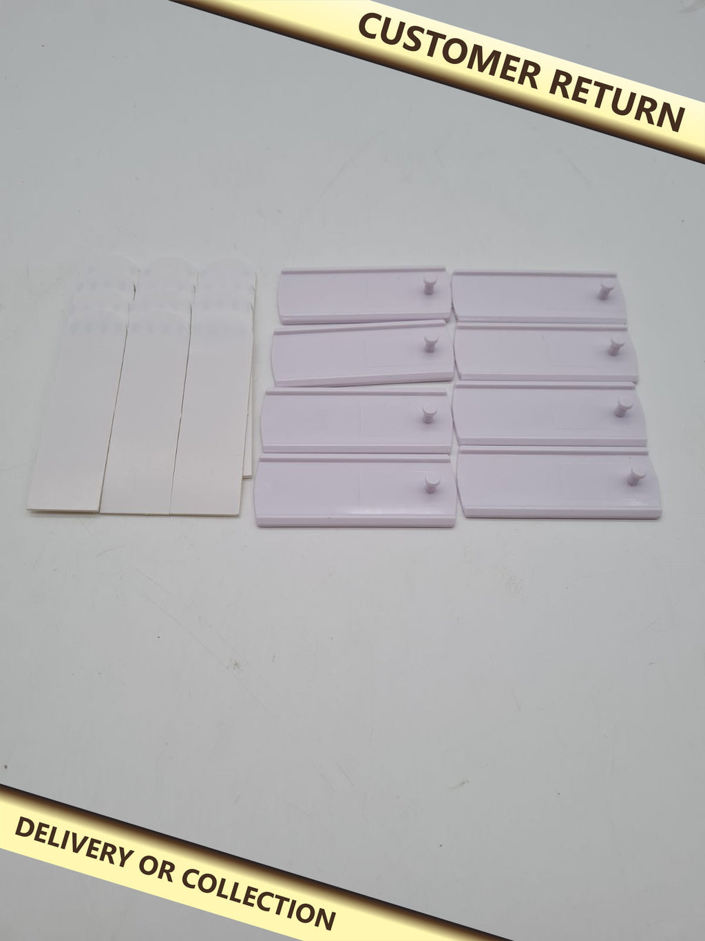 8 Adhesive Picture Frame Hooks â€” photograph 1 — Customer return; auction delivery information shown on image