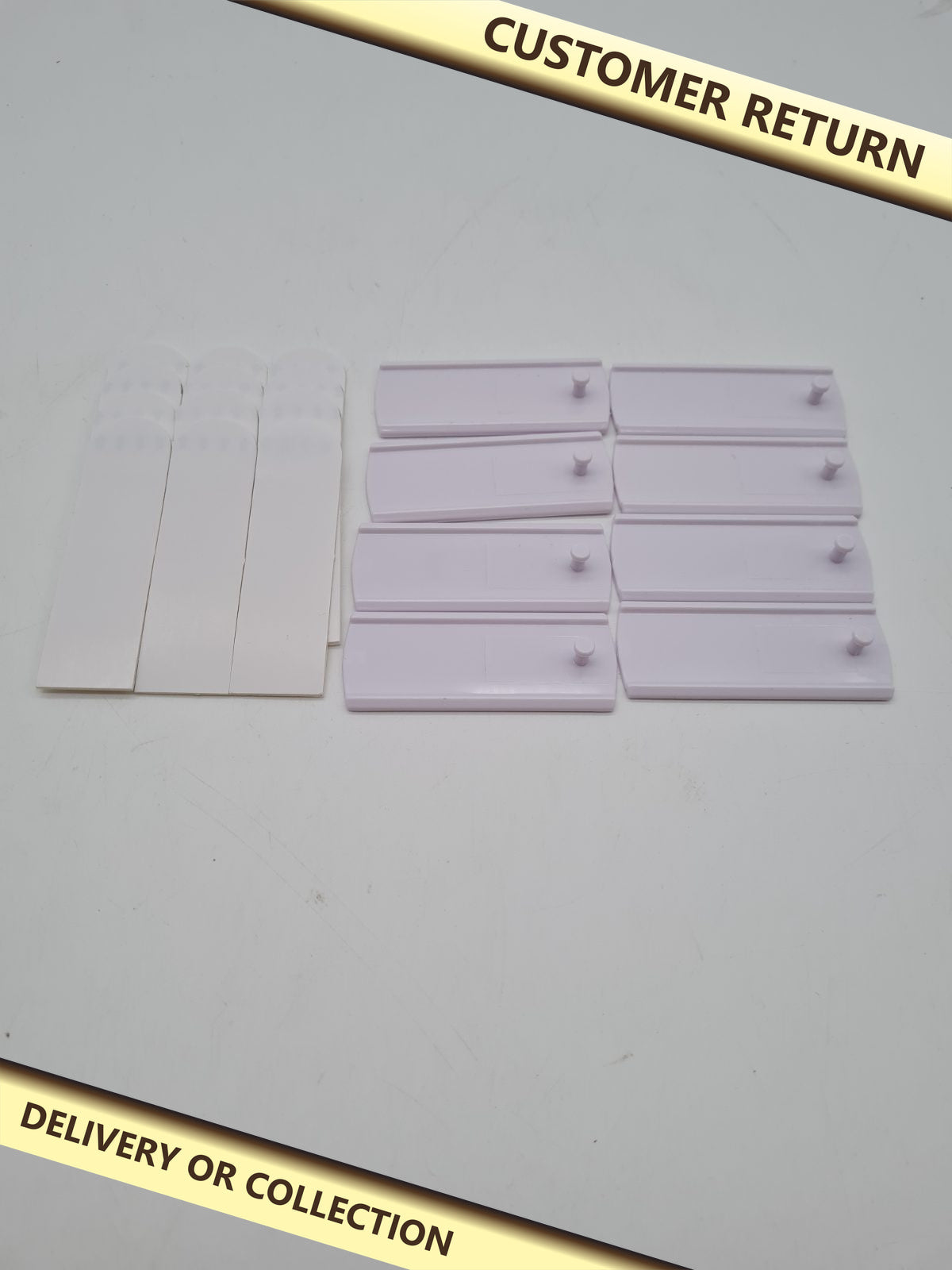 8 Adhesive Picture Frame Hooks â€” photograph 1 — Customer return; auction delivery information shown on image