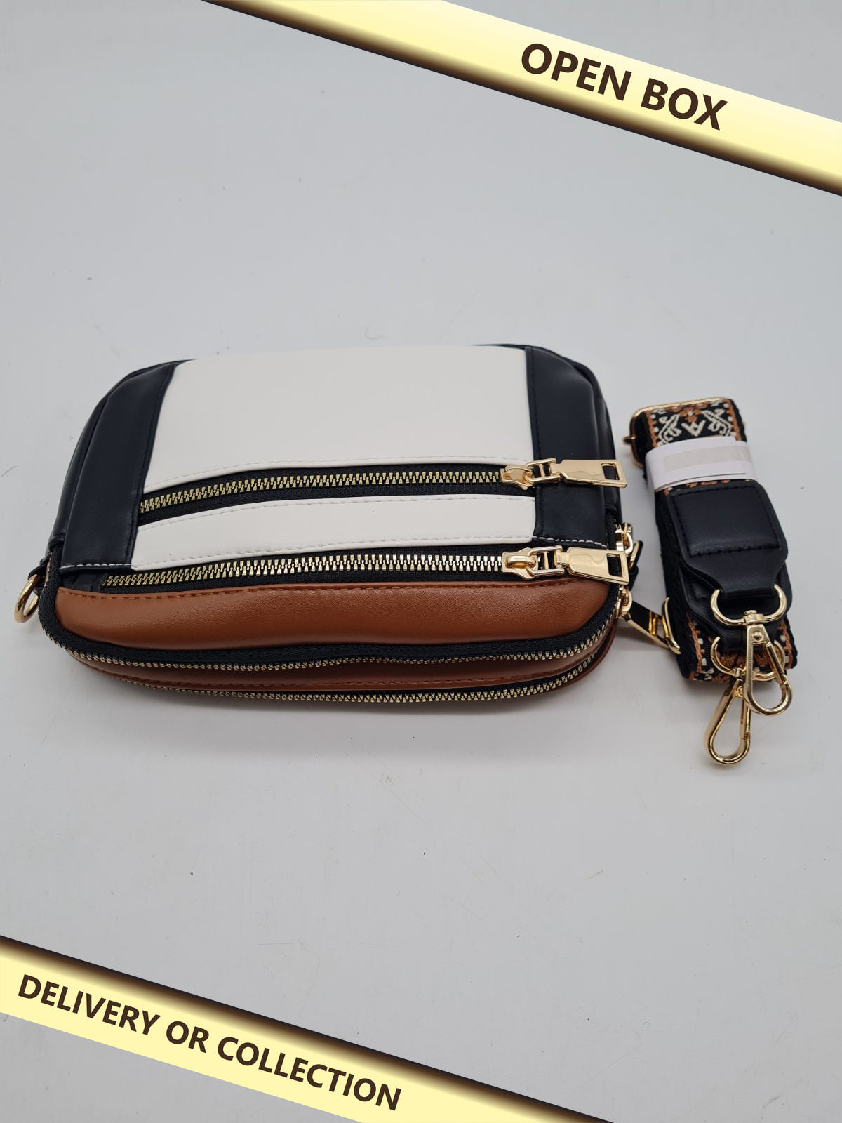 Crossbody Bag — photograph 1 — Open box; auction delivery information shown on image